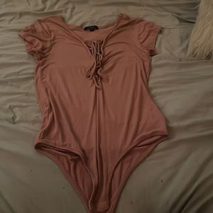 Pink body suit